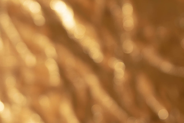 Abstract out of focus golden metallic background - Foto, Imagen