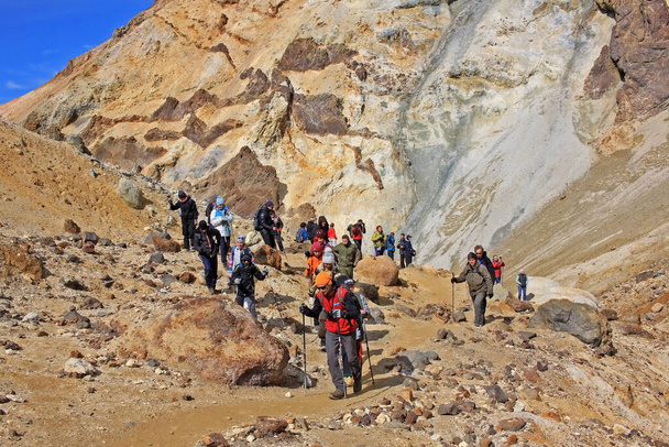Kamchatka Peninsula, Russia - 13 September 2019: The ascent of tourists to the Mutnovsky volcano. Mutnovsky is one of the most active volcanoes of southern Kamchatka - Zdjęcie, obraz