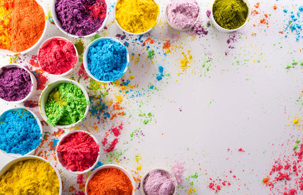 Happy Holi decoration, the indian festival.Top view of colorful holi powder on white background. - Foto, Imagem