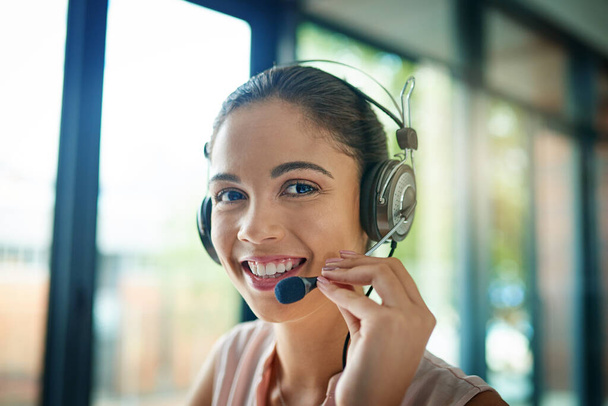 Your business is important to us. Shot of a young woman working in a call center. - Fotoğraf, Görsel