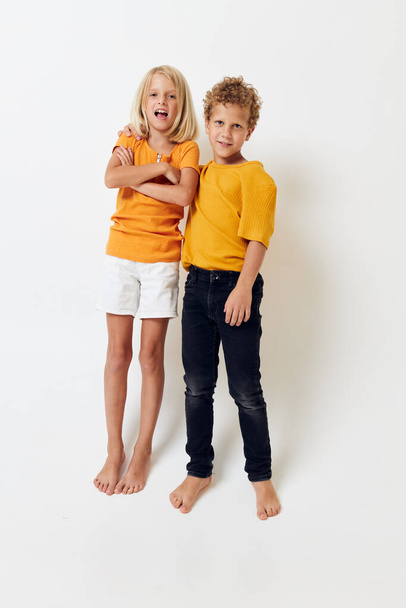 children standing next to hand gesture childhood fun - Фото, зображення