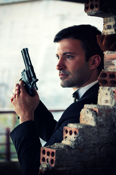 Hitman in tux holding a gun - Фото, зображення