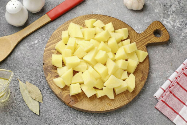 Cut the potatoes into medium cubes or slices. - Fotoğraf, Görsel