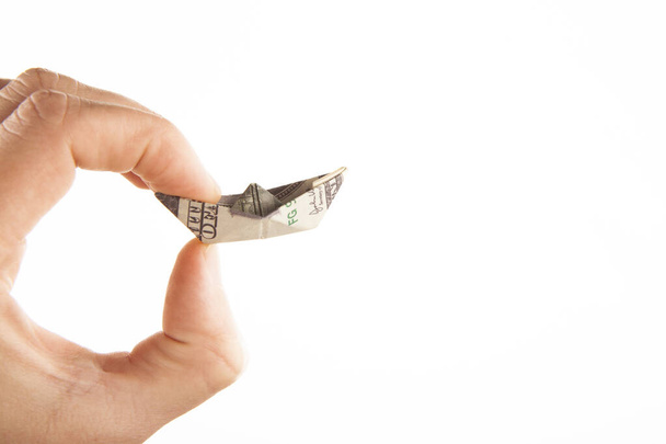 image of origami money ship hand white background - Фото, зображення