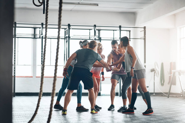 Were in this together. Shot of a fitness group working out at the gym. - Photo, Image