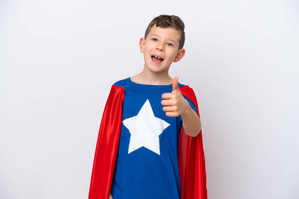 Super Hero little boy isolated on white background with thumbs up because something good has happened - Fotó, kép