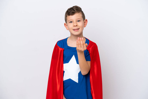 Super Hero little boy isolated on white background inviting to come with hand. Happy that you came - Foto, immagini
