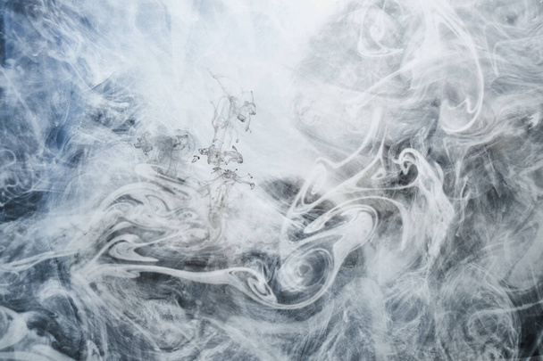Dark smoke on white ink background, colorful fog, abstract swirling ocean sea, acrylic paint pigment underwater - Fotó, kép
