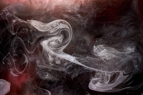Black and red ink background, colorful fog, abstract swirling ocean, acrylic paint pigment underwater, white smoke - Zdjęcie, obraz
