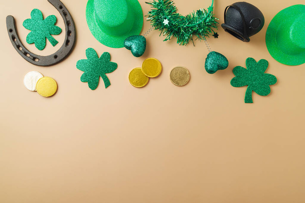 St Patrick's day holiday background with lucky charms, shamrock and  leprechaun hat. Top view with copy space - Photo, image