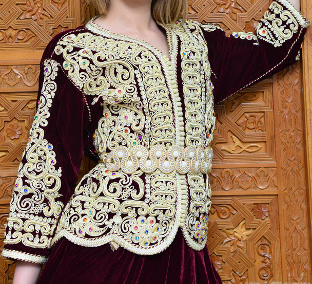 The Moroccan caftan is a Moroccan women's traditional costume. It is considered one of the oldest traditional clothes in the world - Photo, image