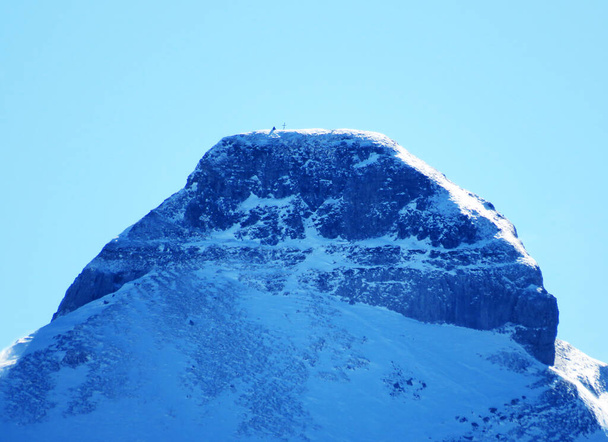 Snow-capped alpine peak Zuestoll (2234 m) in the Churfirsten mountain range, between the Toggenburg region and Lake Walensee or Lake Walenstadt - Obertoggenburg, Switzerland (Schweiz) - Valokuva, kuva