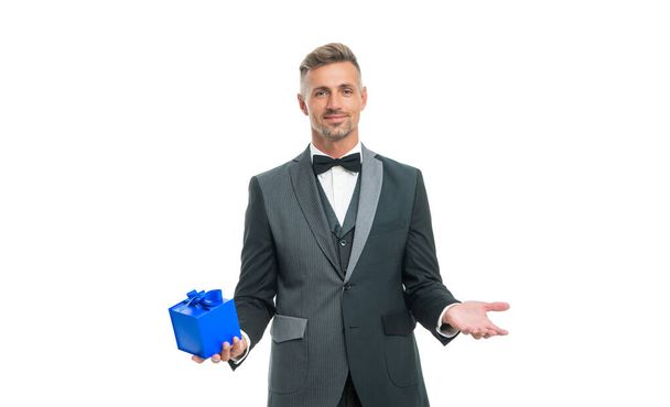 positive man in tuxedo and bow tie hold present box isolated on white background - Φωτογραφία, εικόνα