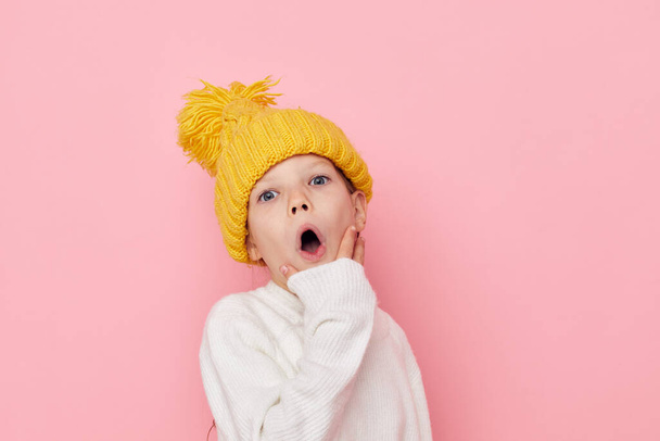 Portrait of happy smiling child girl fun in a yellow hat fun childhood unaltered - 写真・画像
