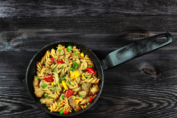 Pasta with meat and vegetables on saucepan - Фото, зображення