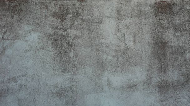 The old cement wall was weathered, the surface was scratched, the surface was scratched and damaged. For a mysterious retro-conservative background. - Photo, Image