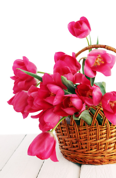 tulips in a wicker basket - Foto, imagen