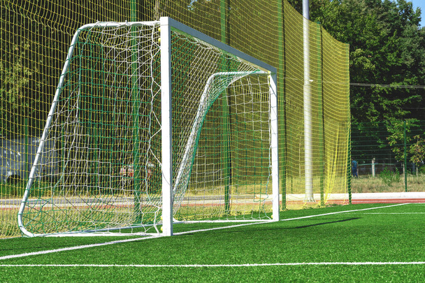 soccer gates. Football goal at the stadium. Football field with artificial lawn. Concept other party of soccer.  At stadium. - Photo, Image