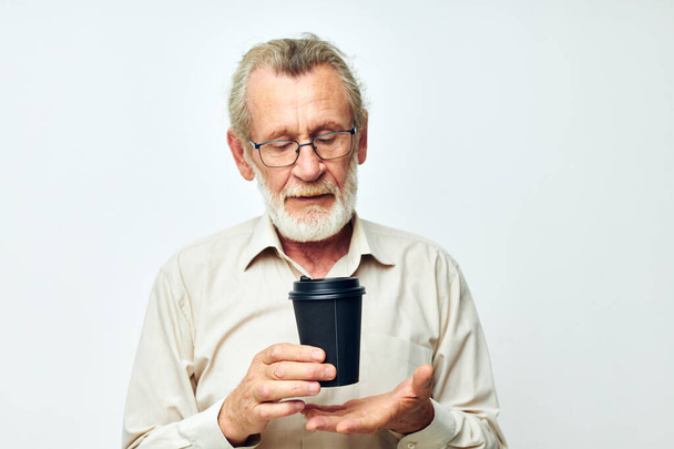 Portrait elderly man disposable glass drink emotions isolated background - Φωτογραφία, εικόνα