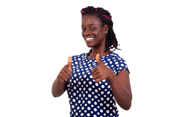 Young woman wearing casual clothes making positive hand gesture, thumbs up smiling and happy. cheerful expression and winning gesture - Фото, изображение