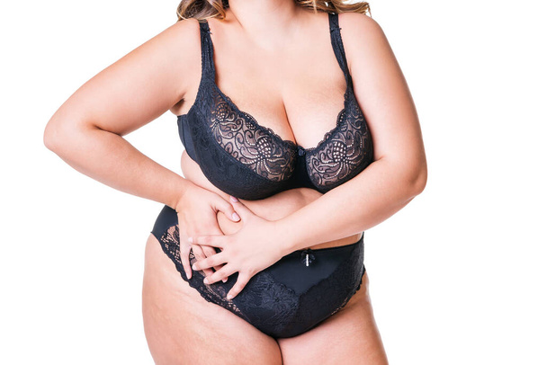 Fat woman in black lingerie, overweight female body isolated on white background, plastic surgery concept - Фото, зображення