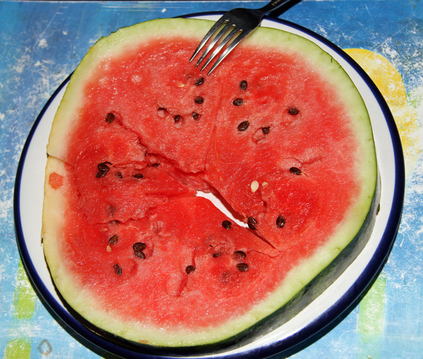gesneden watermeloen rode cirkel met zaden - Foto, afbeelding