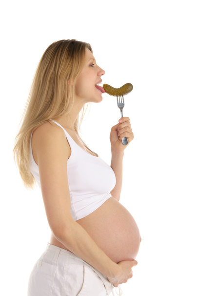 Pregnant woman licks pickle - Zdjęcie, obraz