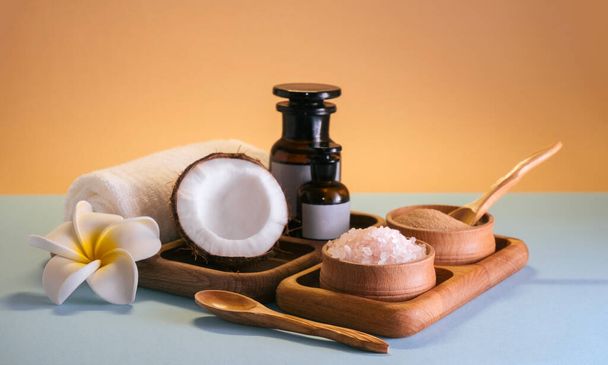 Spa set with oils, sea salt and clay scrub on a wooden tray. Self-care concept. - Fotoğraf, Görsel