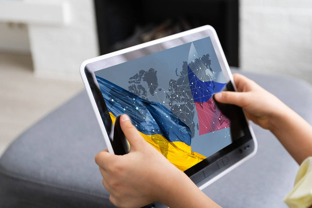 tablet with war ukraine and russia. Ukraine, european union, Russia flag. - Photo, Image