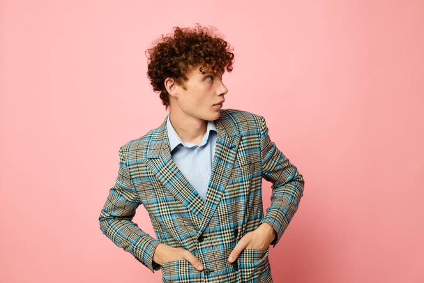 cute red-haired guy checkered blazer elegant style posing fashion pink background unaltered - Foto, imagen