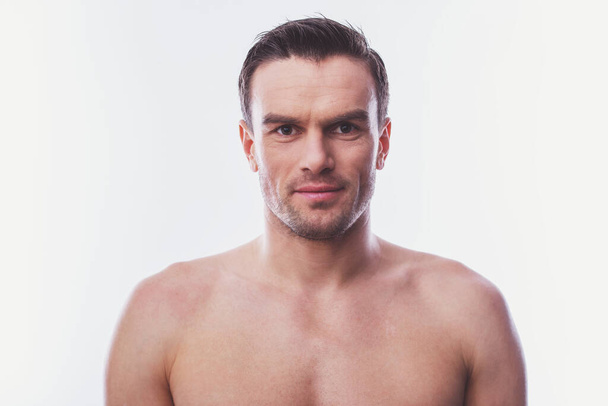 Portrait of handsome naked man looking at camera, isolated on a white background - Фото, зображення