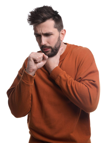Man coughing on white background. Cold symptoms - Foto, afbeelding