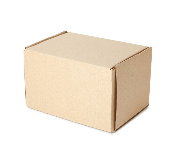 One closed cardboard box isolated on white - 写真・画像