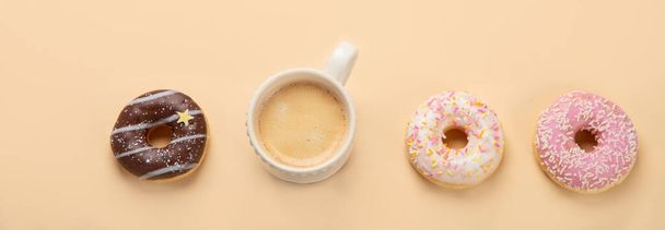 Donuts with coffee on yellow background. Bakery, baking concept. Flat lay, top view, copy space, panorama - Fotoğraf, Görsel