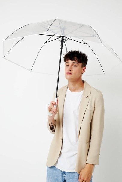 handsome guy rain protection in hand in hand modern style isolated background unaltered - 写真・画像