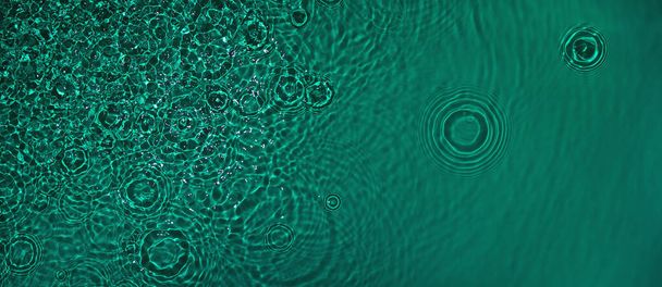 transparent dark green colored clear calm water surface texture  - Photo, Image