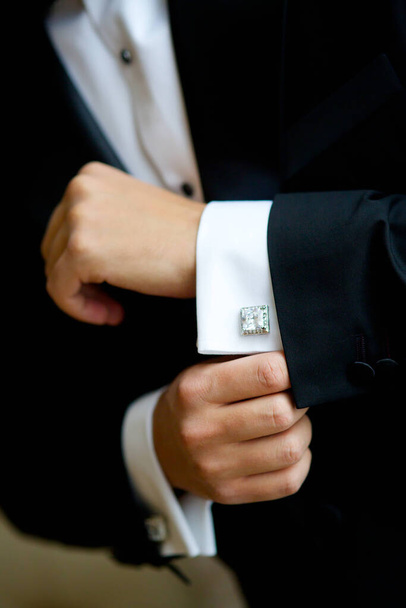 Men's hands correct shirt with cufflinks - Foto, immagini