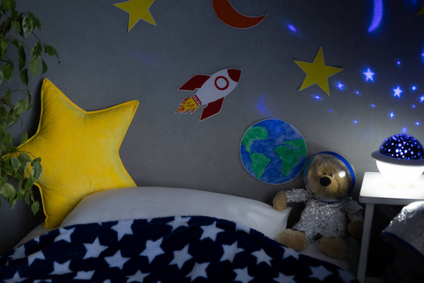 Children's room space interior. Kid pretend to be astronaut - Foto, Imagem