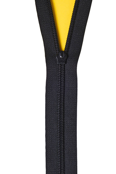 Unbuttoned zipper with yellow and white background with copyspace - Zdjęcie, obraz