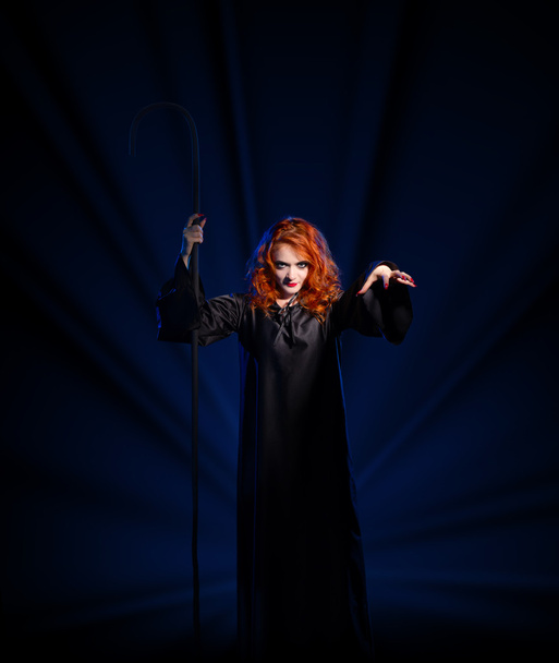 Witch isolated on blue rays background - Valokuva, kuva