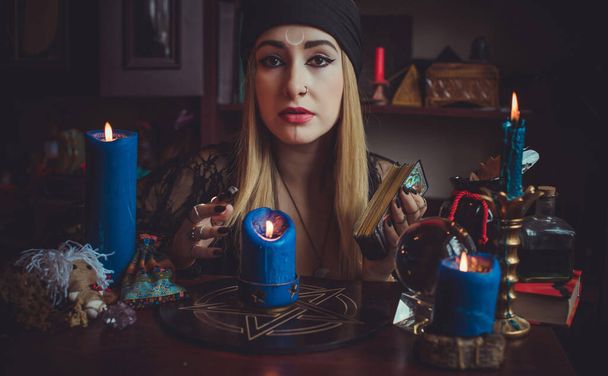 Concept of fortune telling and predictions of fate, magic and wicca elements on a table, witch look - Photo, Image