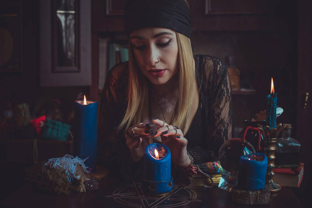 Concept of fortune telling and predictions of fate, magic and wicca elements on a table, witch look - Photo, Image