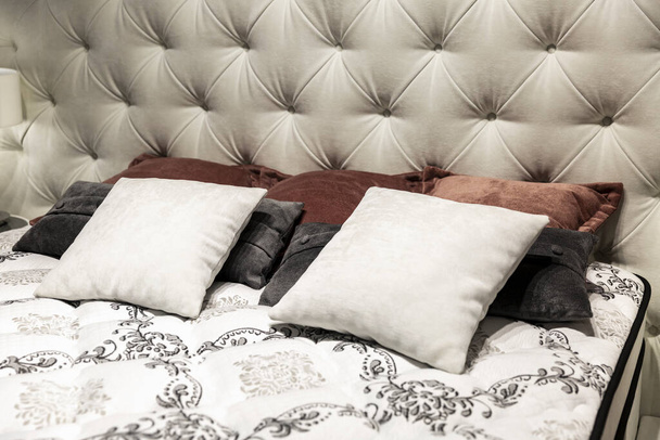 Pillows on a cozy bed. Interior design, decor and functionality. Close-up. - Fotoğraf, Görsel