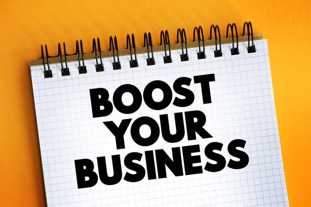 Boost Your Business Text auf Notizblock, Konzept Hintergrund - Foto, Bild