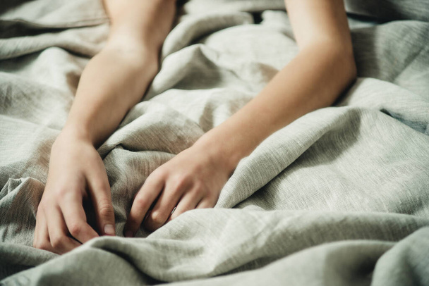 hands on bed linen close-up - Foto, Imagem