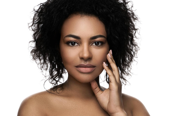 Portrait of young beautiful black woman with smooth skin on white background - Fotó, kép
