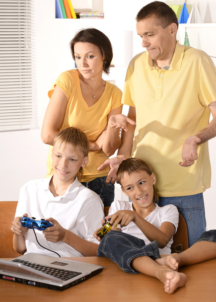 Family playing on laptop - Photo, Image