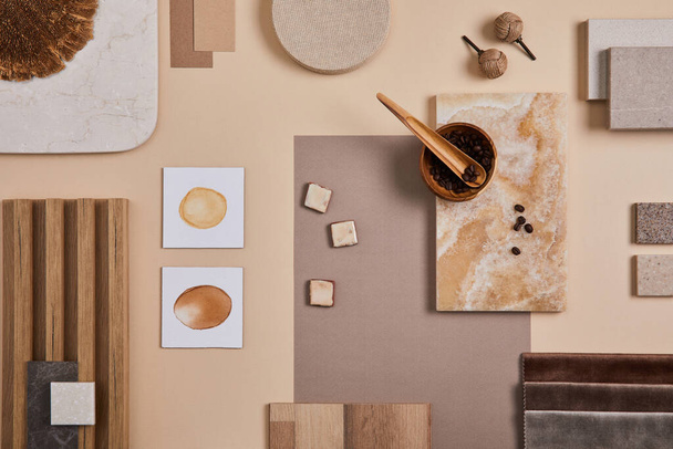 Flat lay of stylish architect moodboard composition with beige samples of textile, paint, wooden lamella panels and tiles. Top view. Copy space. Template. - Фото, изображение