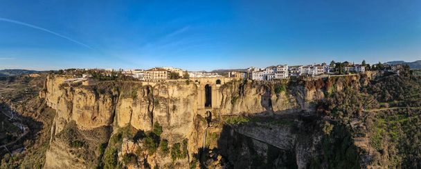 Drone view at the old bridge of Ronda on Andalusia in Spain - Photo, Image