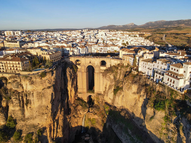Drone view at the old bridge of Ronda on Andalusia in Spain - Photo, Image